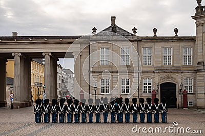 COPENHAGEN, DENMARK â€“ Changing of the guard in front of the palace in Amalienborg Editorial Stock Photo